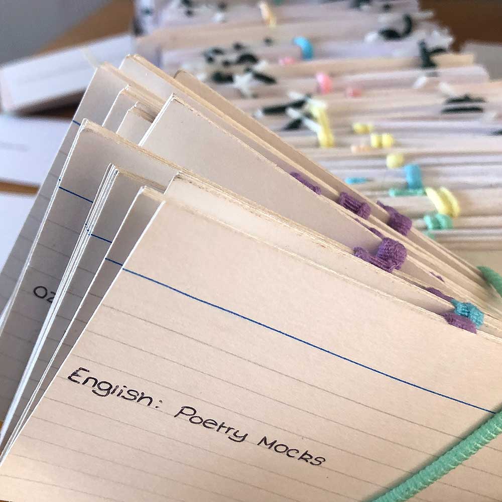 A large pile of flash cards for English poetry